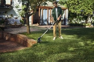 Aspire grass trimmer, man trimming